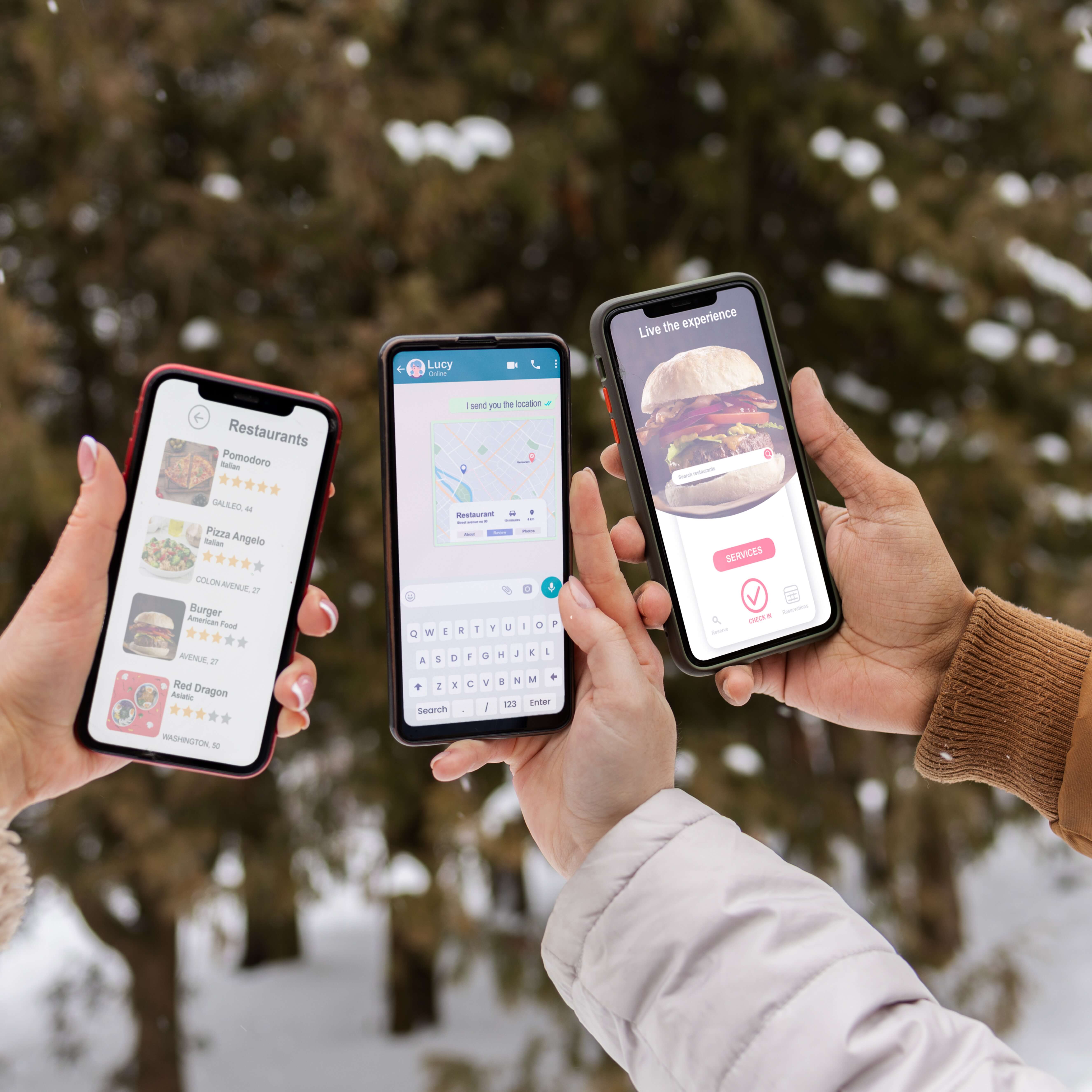 high-angle-friends-holding-smartphones (1)